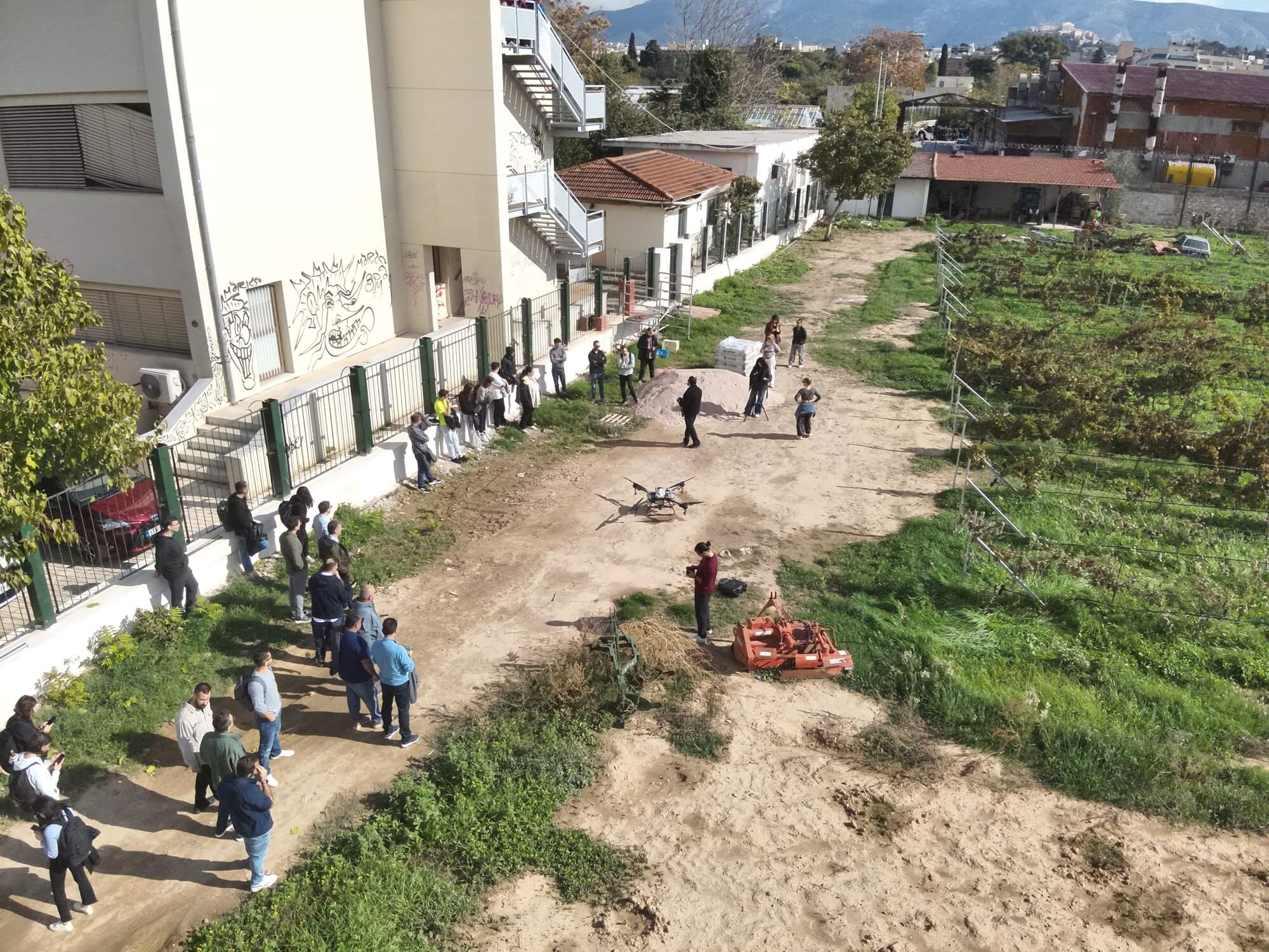 Aerial view of the demonstration site and attendees along the fence