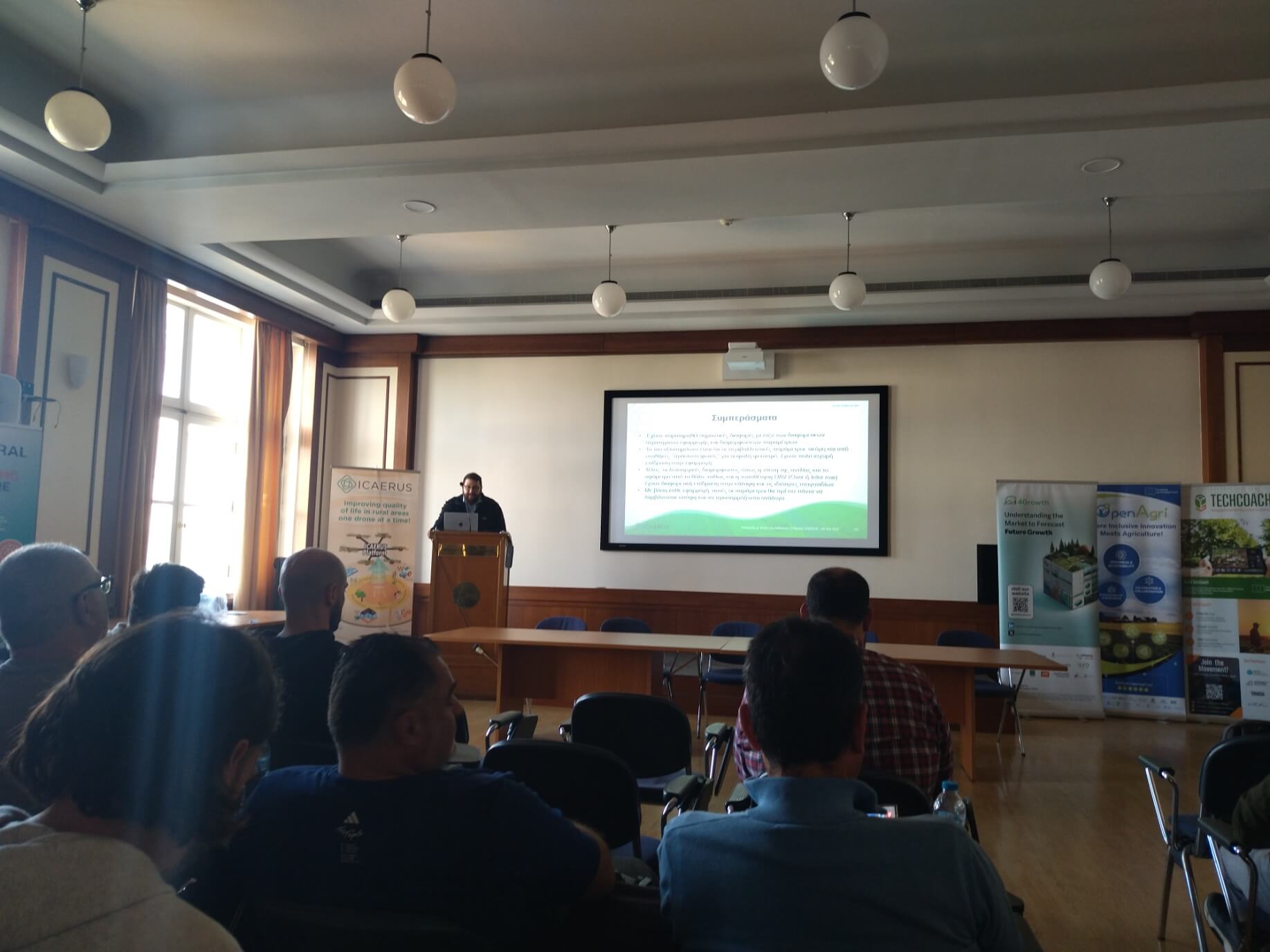 Wide view of the room during the conclusions slide